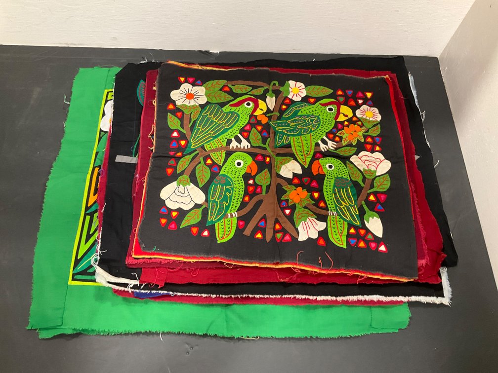 Grouping of bird mola textile panels