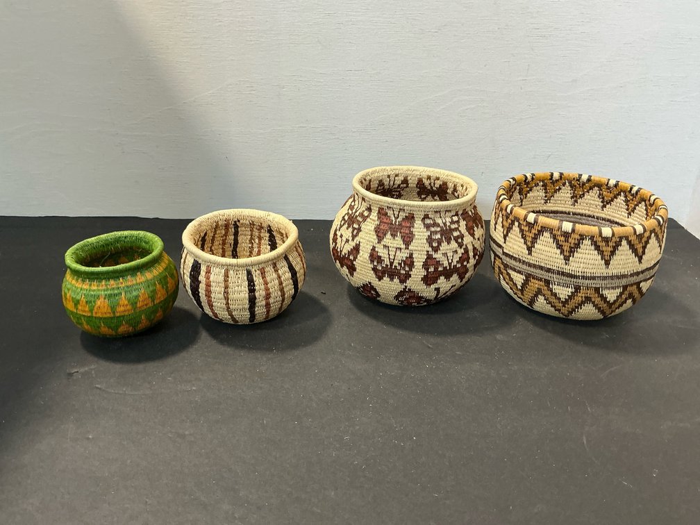 Grouping of coiled woven fiber baskets