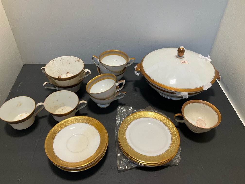 White & gold porcelain dinnerware with covered tureen