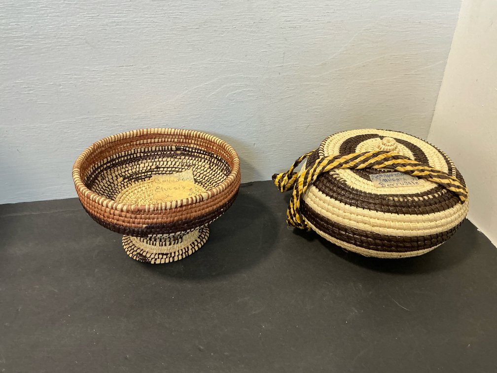 Pair of coiled woven natural fiber baskets