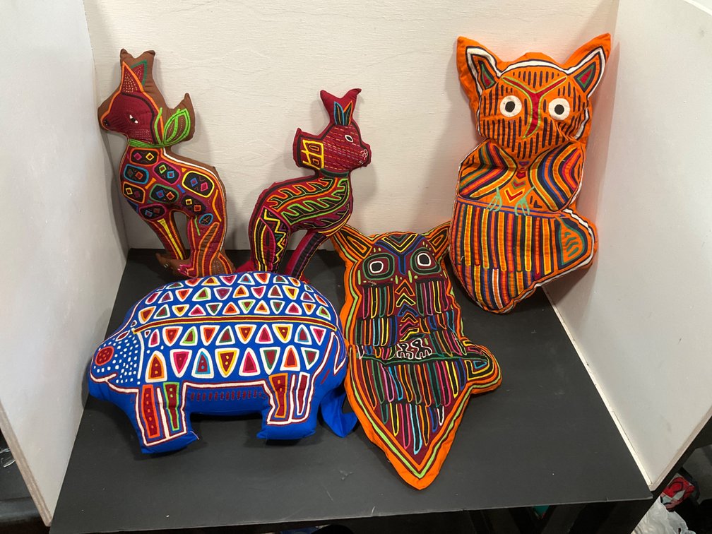Reverse appliqué mola fabric animal pillows
