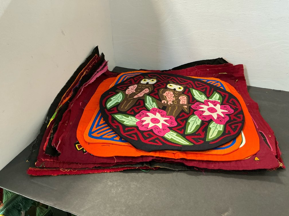 Grouping of mola reverse-applique textile panels