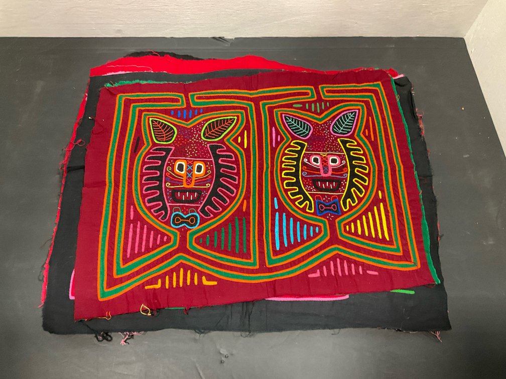 Grouping of reverse appliqué mola textile panels