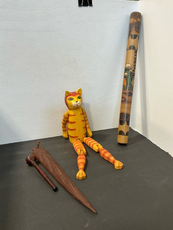 Carved wood articulated cat & bamboo rainstick grouping