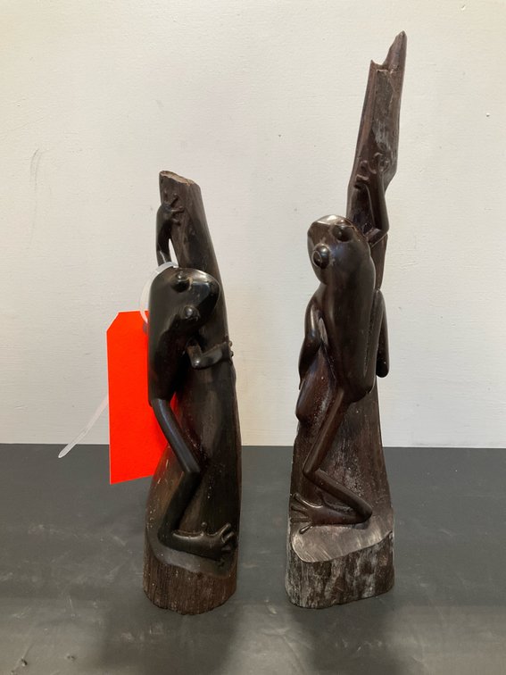 Pair of carved dark wood climbing frog sculptures