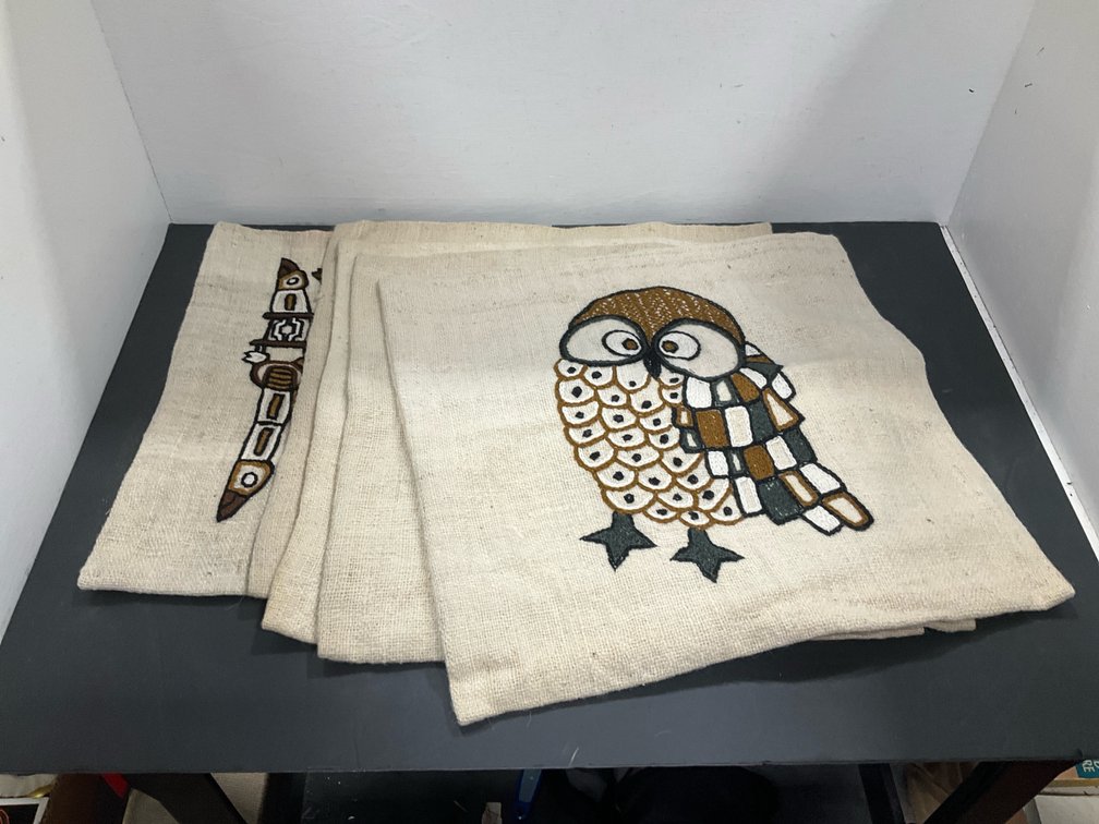 Set of embroidered burlap cushion covers