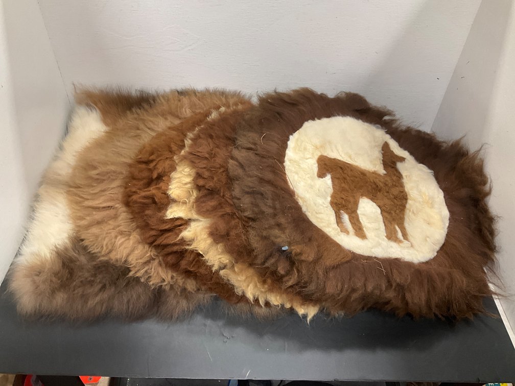 Grouping of fur rugs, mats & cushion covers