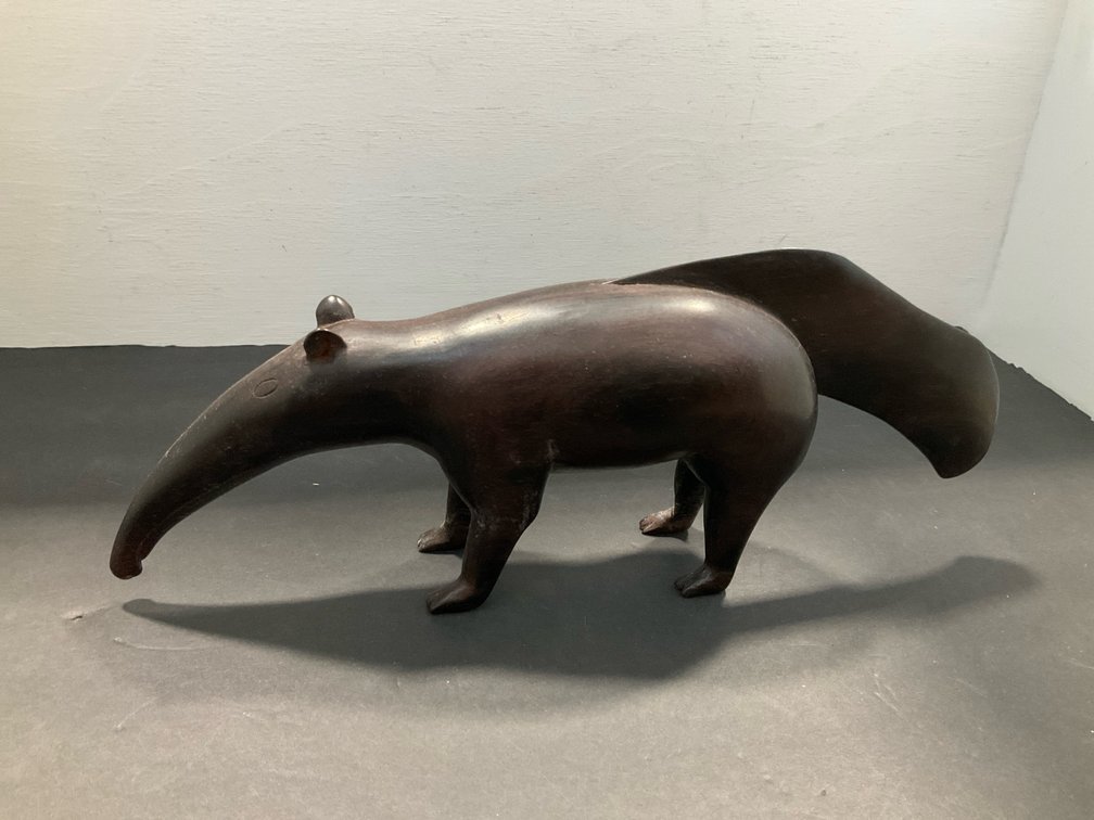 Carved dark wood anteater sculpture