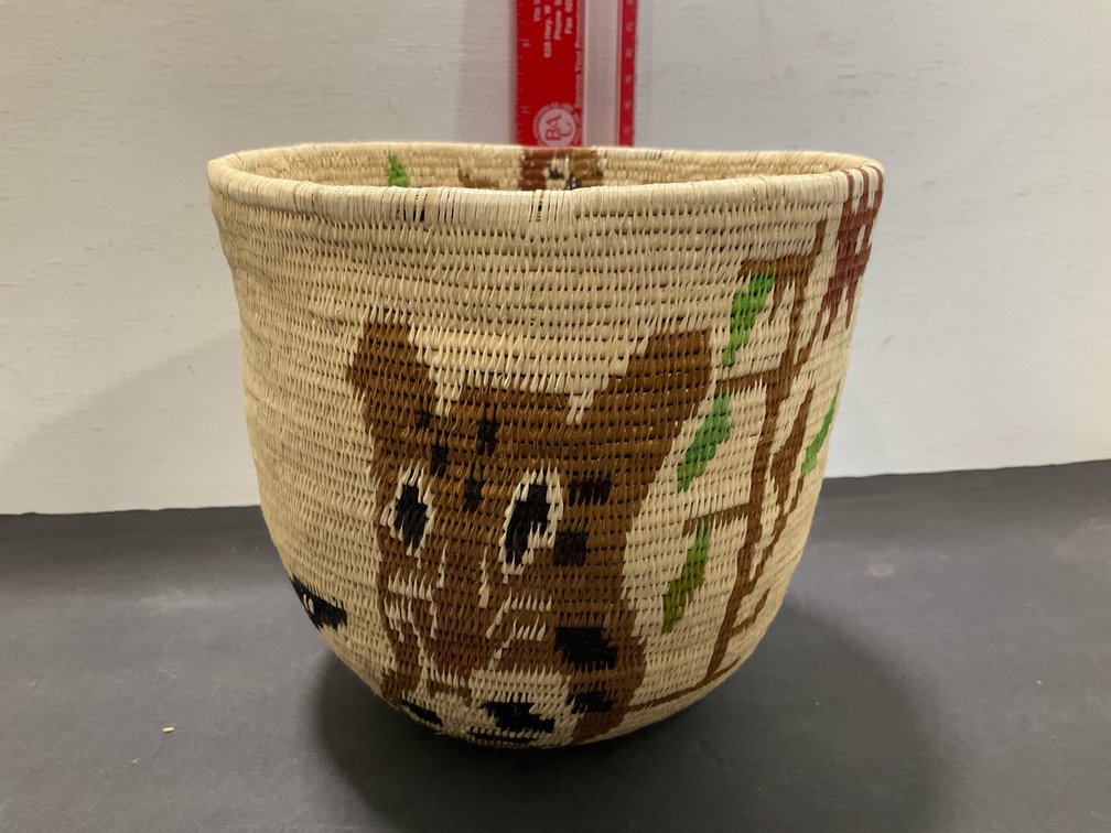 Coiled woven pictorial basket with wildlife motifs