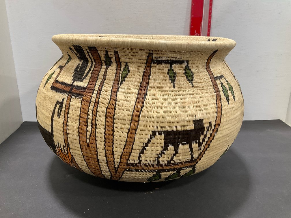 Coiled woven pictorial basket with animal & tree motifs