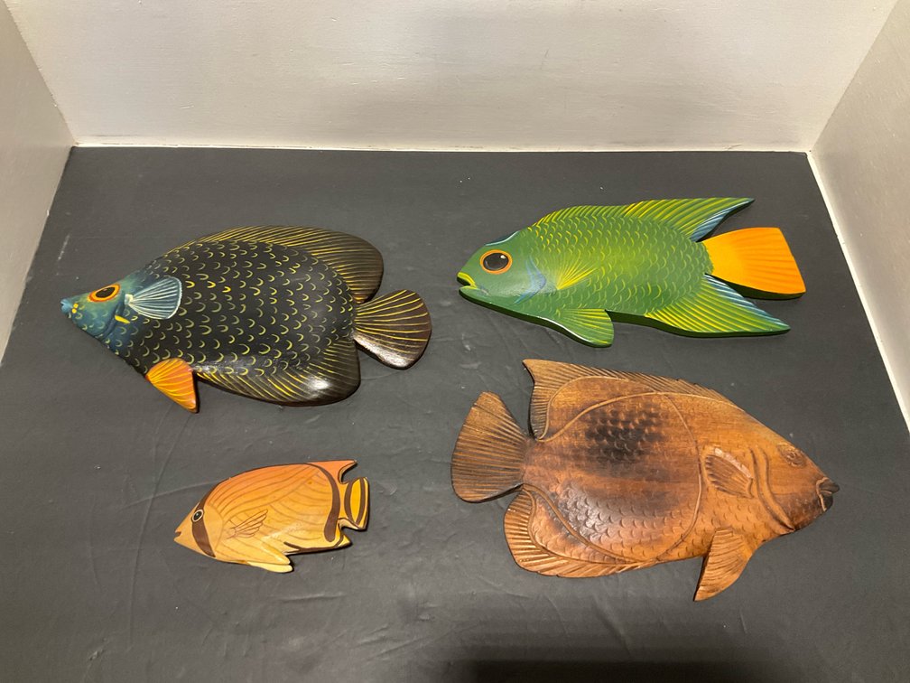Grouping of carved wood fish wall hangings