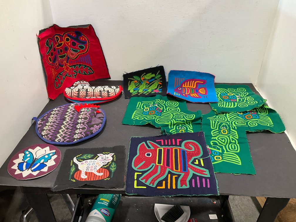 Grouping of mola panels & handmade textiles