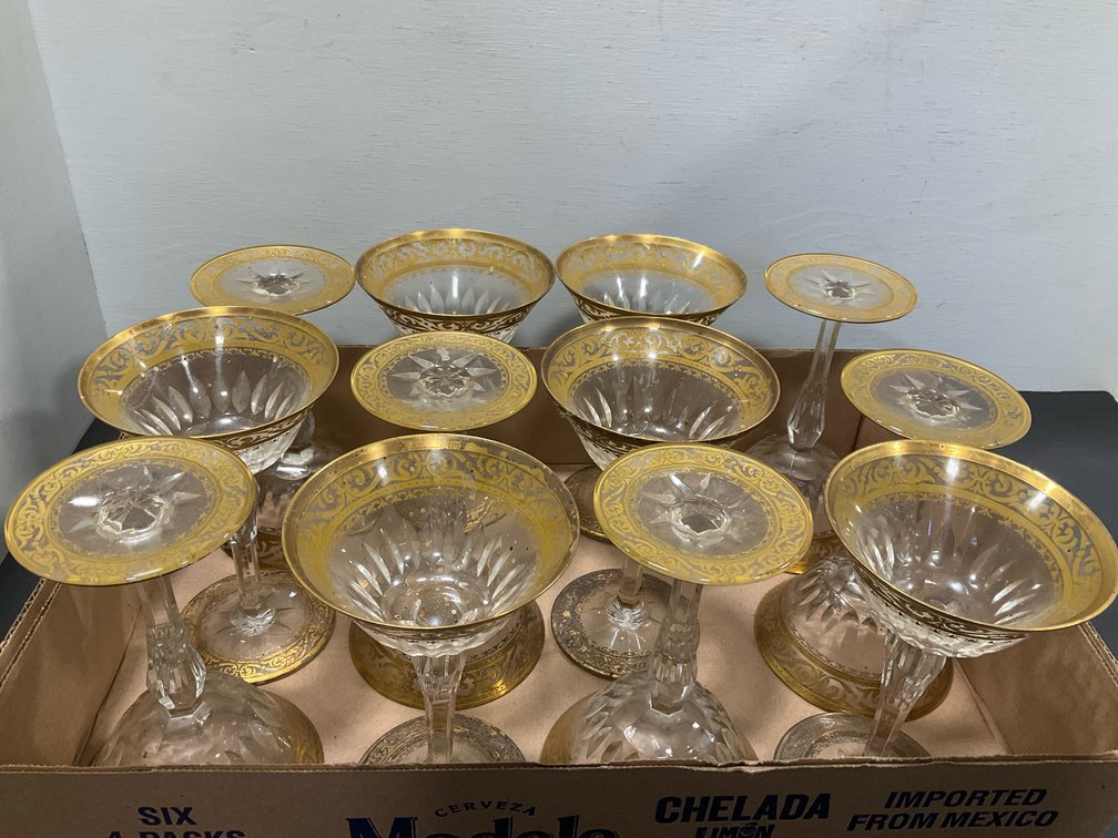 Set of cut crystal coupe glasses with gold encrusted rims