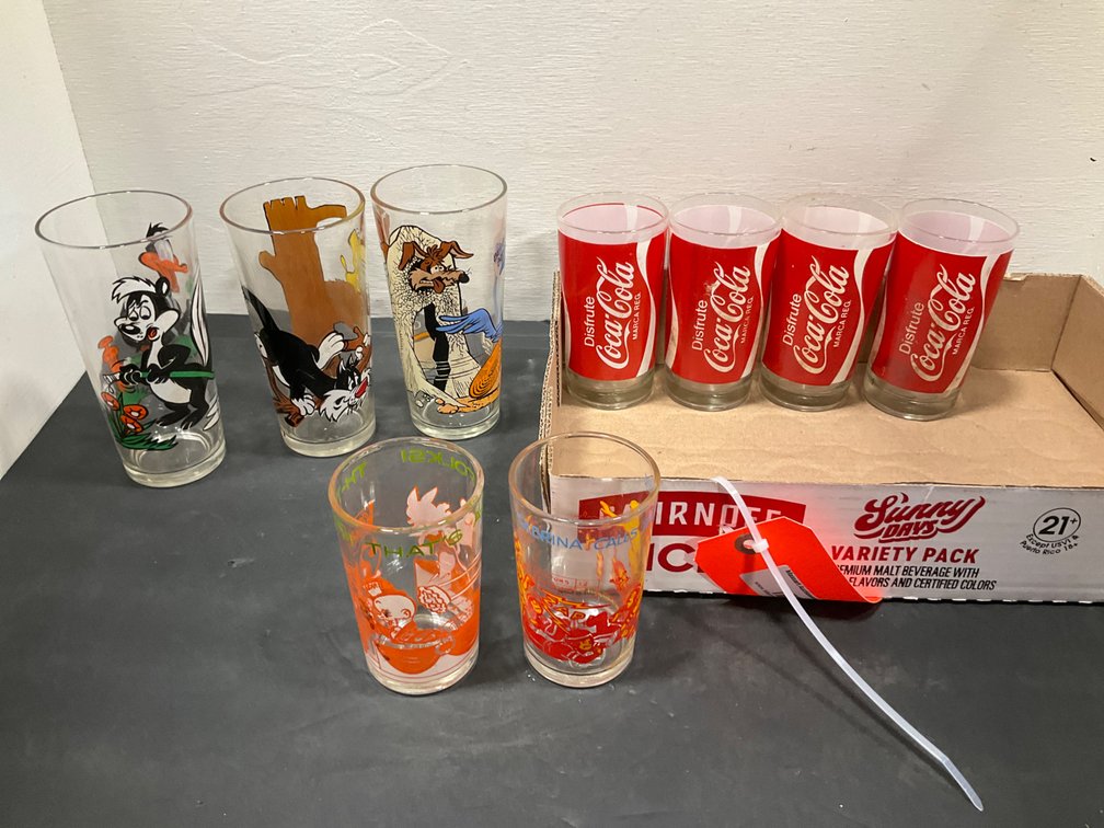 Group of promotional drinking glasses with printed graphics