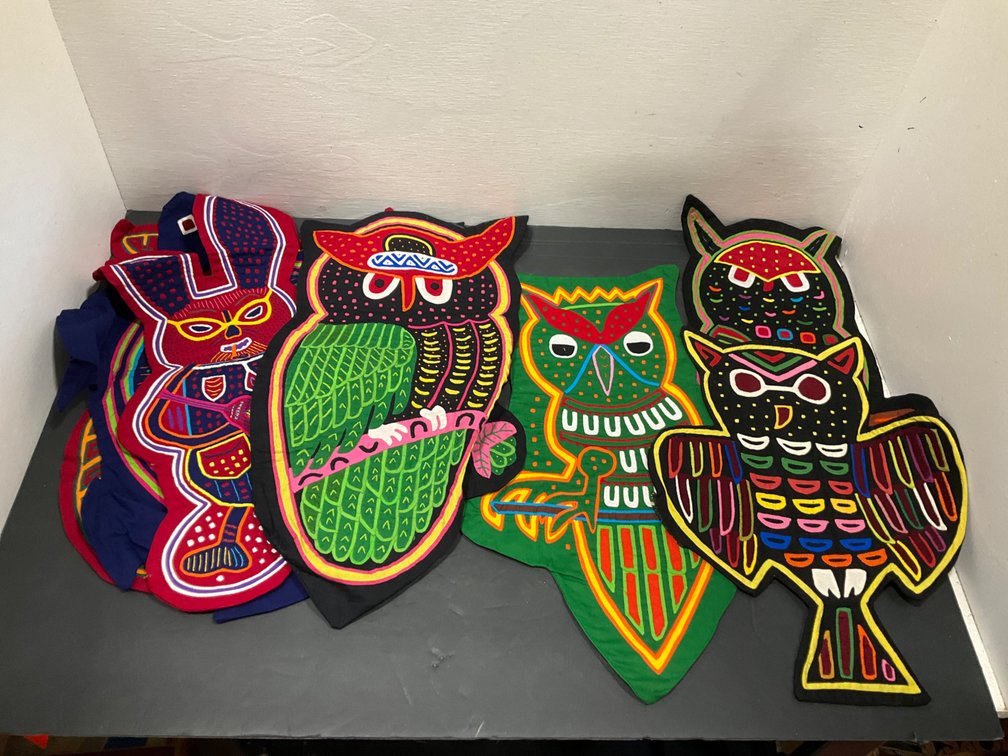 Grouping of reverse-appliqué mola textile panels