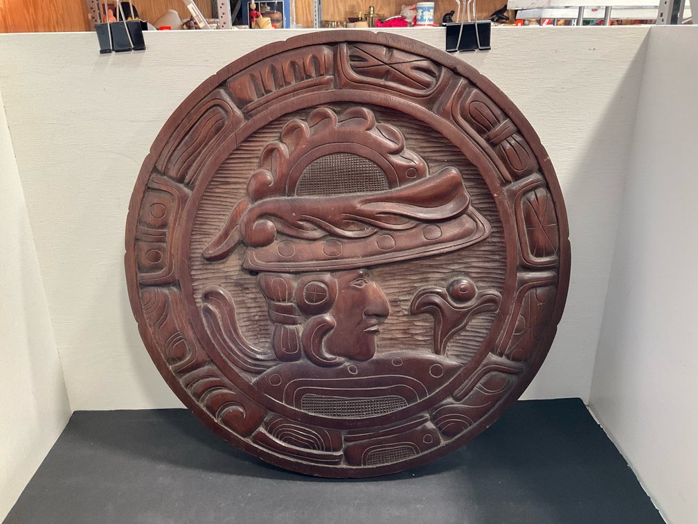 Carved wood circular tabletop with Mayan motif