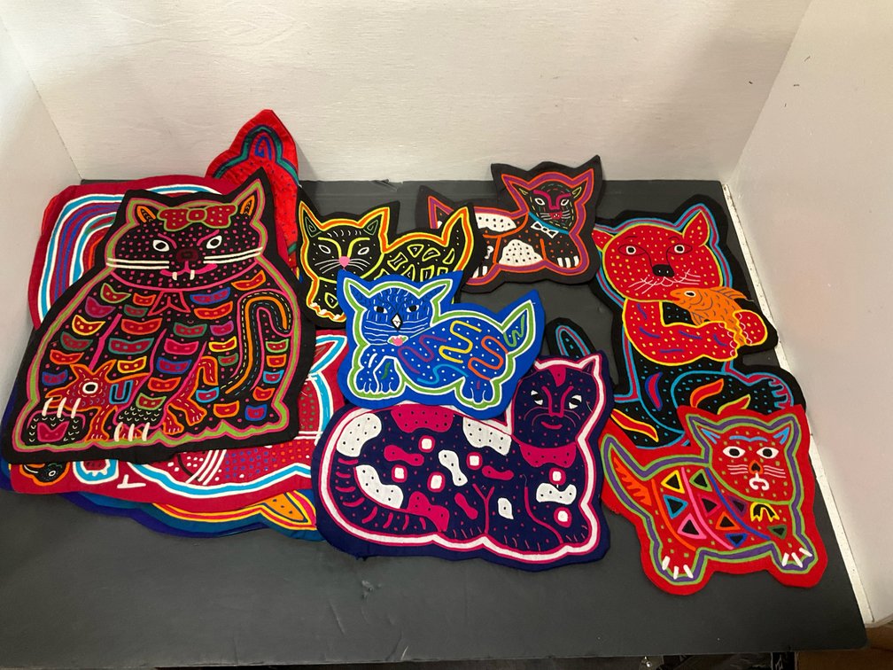 Group of cat-shaped mola applique textile panels