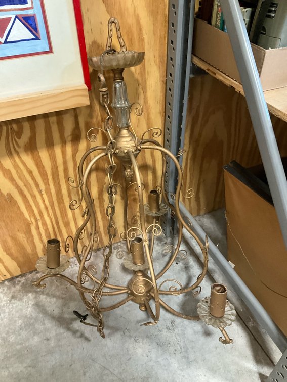 Gold-tone metal and glass scrolled chandelier