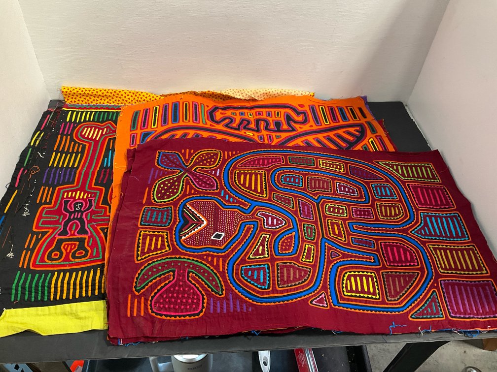 Grouping of reverse appliqué mola textile panels