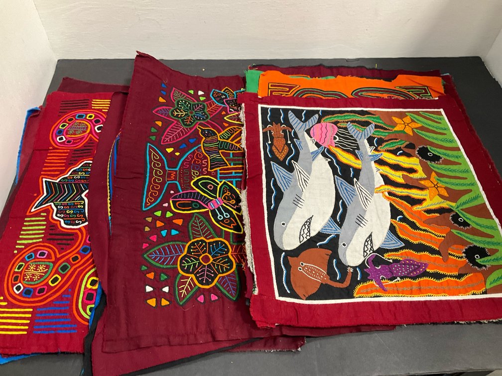 Grouping of reverse appliqué mola textile panels
