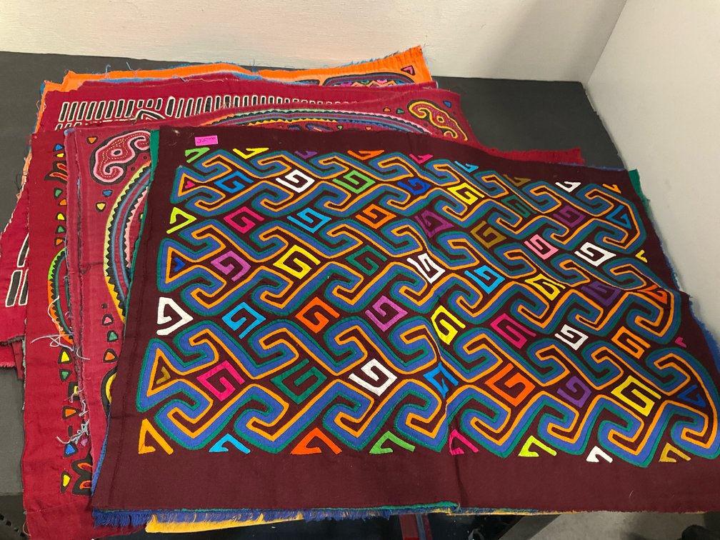 Grouping of reverse appliqué mola textile panels