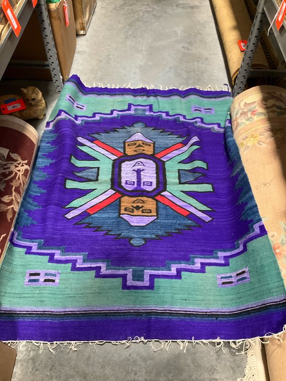 Southwest-style woven textile rug in purple & teal