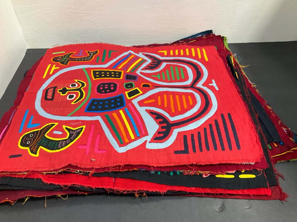Grouping of reverse-appliqué mola textile panels