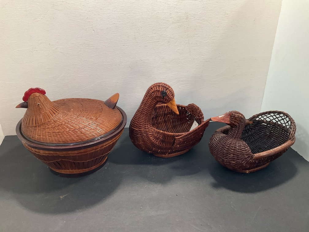 Woven wicker bird baskets with carved wood details