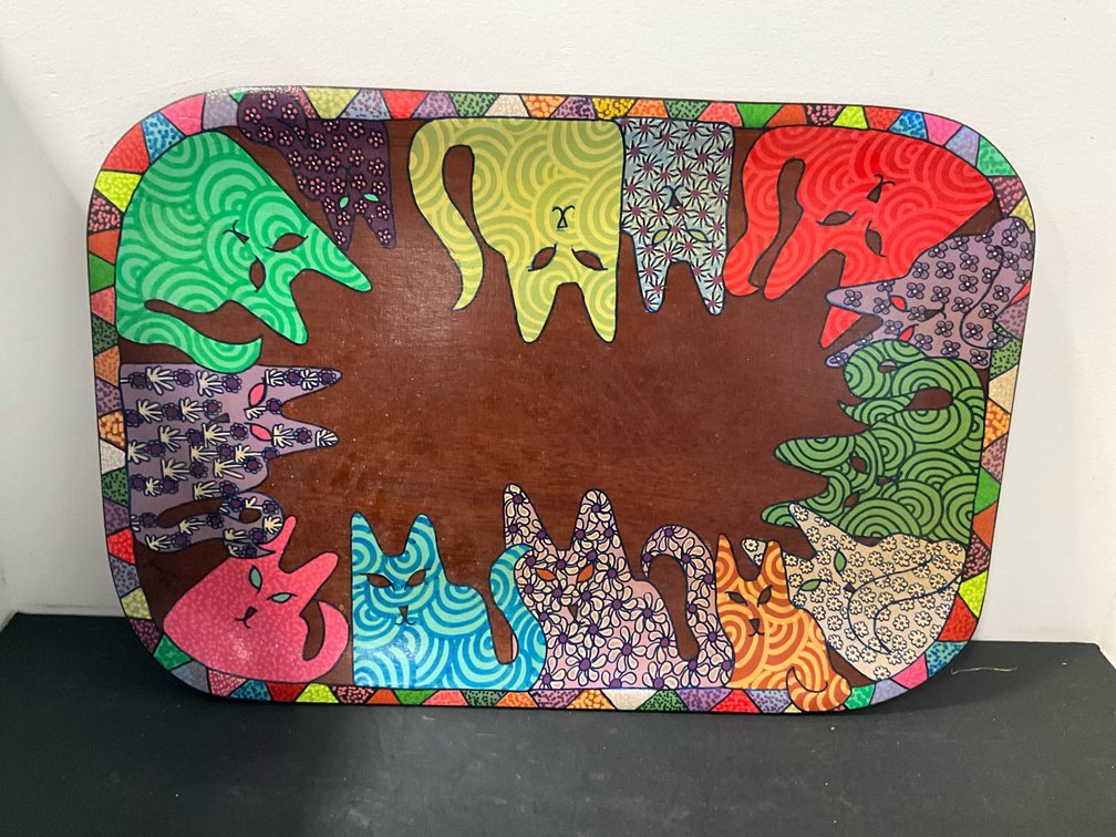 Hand-painted wooden tray with stylized cat motifs