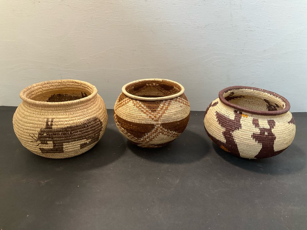 Coiled woven fiber baskets with animal & geometric motifs