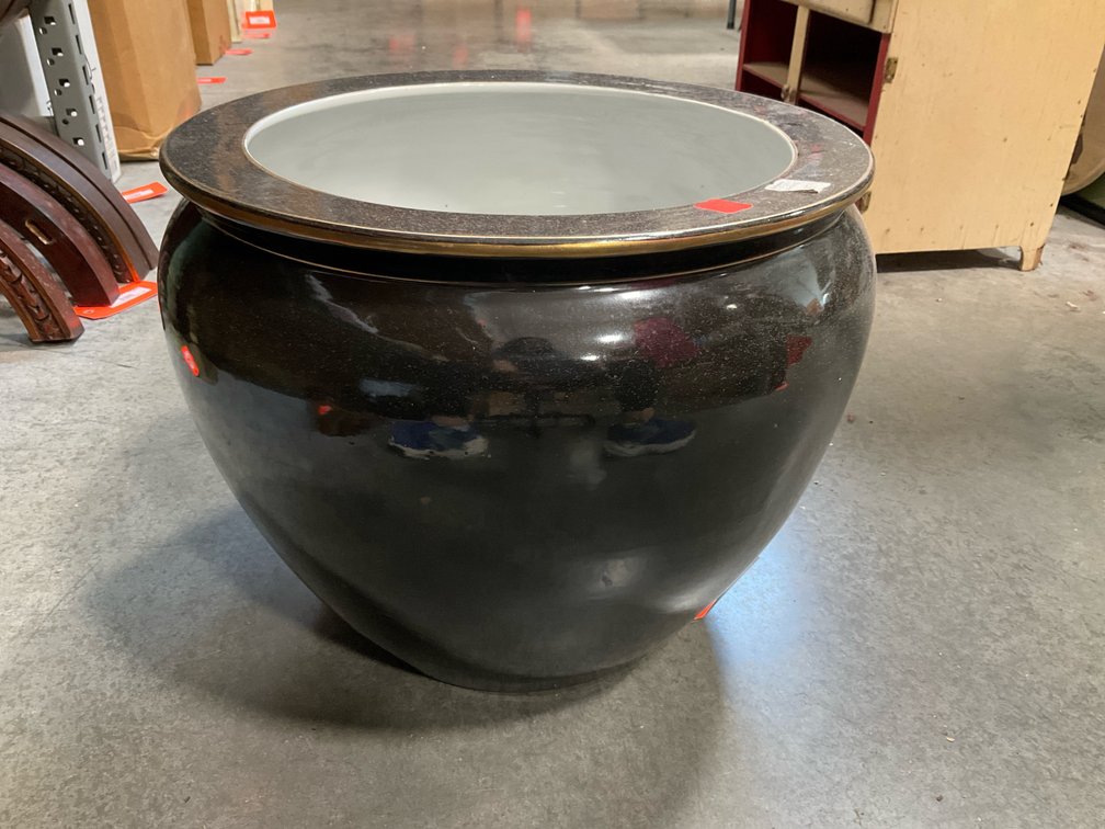 Black ceramic fishbowl planter with goldfish interior