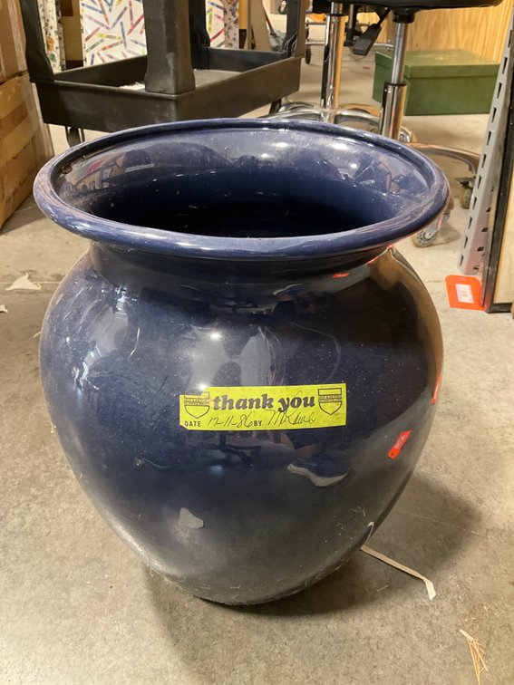 Dark blue glazed ceramic bulbous urn planter