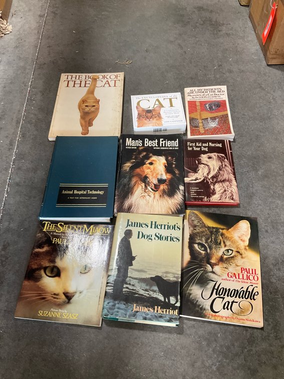 Grouping of cat & dog books & 1999 calendar