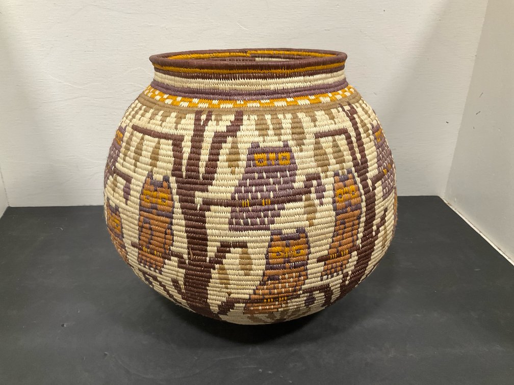 Polychrome coiled basket jar with owl motifs