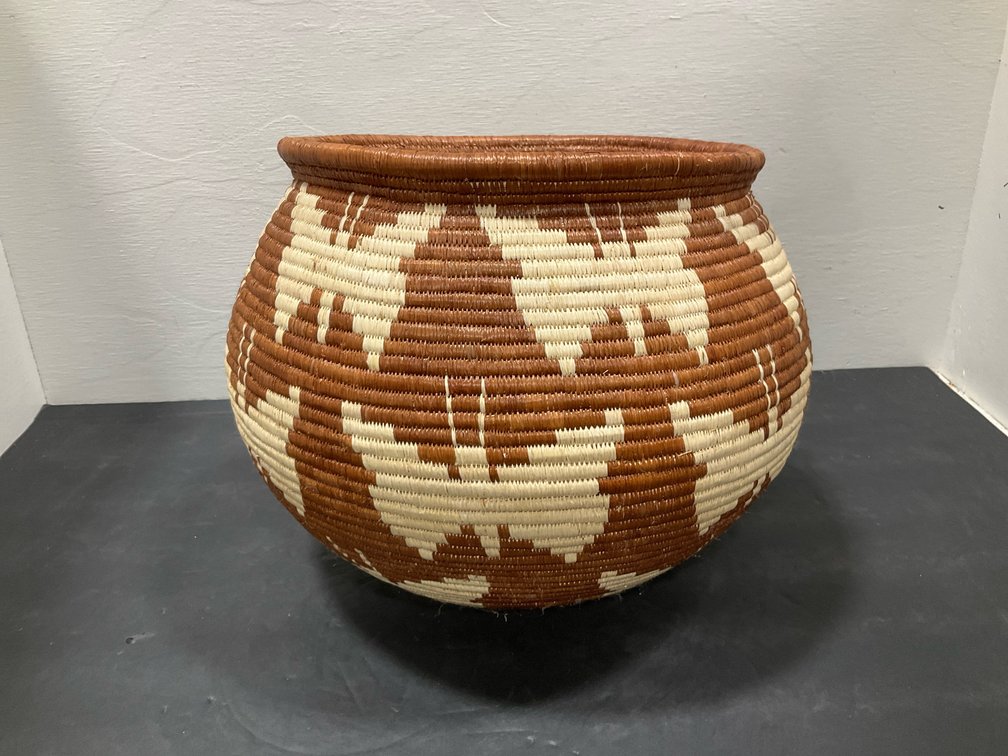 Coiled woven basket with butterfly motifs