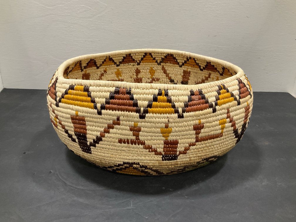 Coiled woven basket bowls with geometric patterns