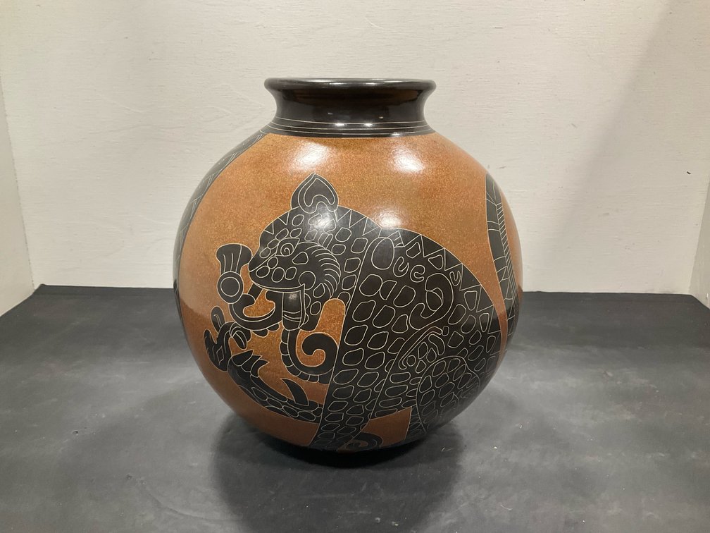 Roger Calero etched ceramic jar with jaguar design