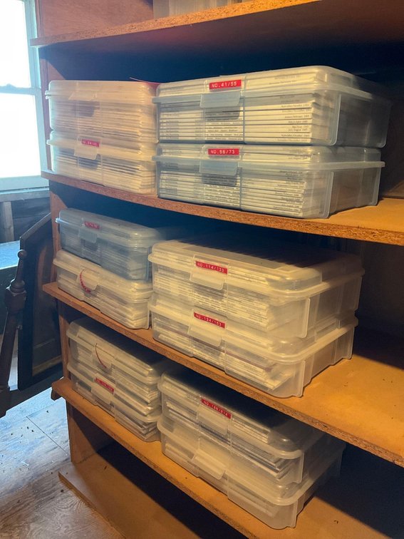Storage containers full of wood working related magazines-Attic