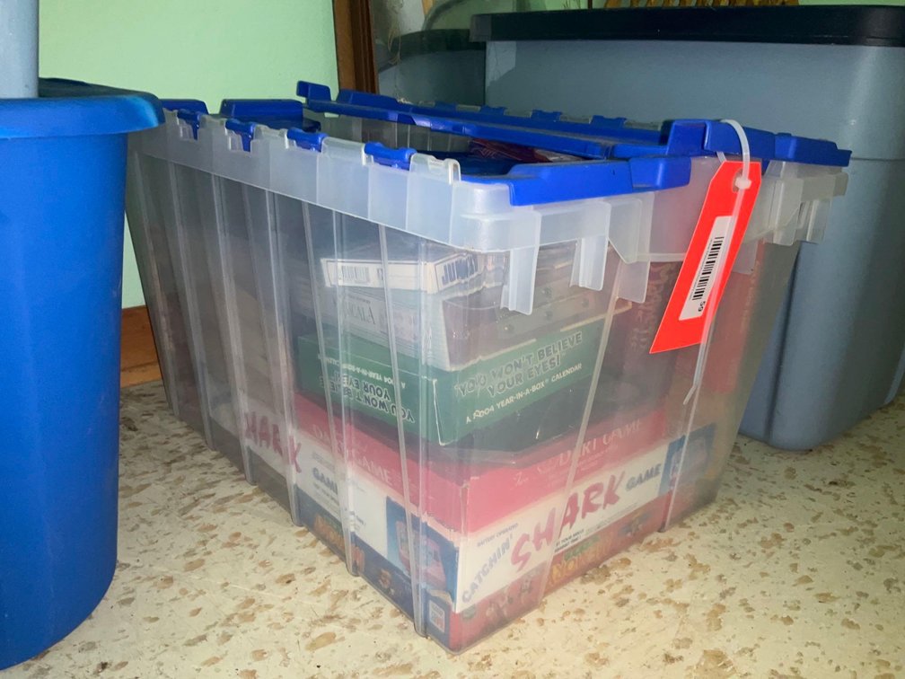 Covered tote & assorted games-Upstairs