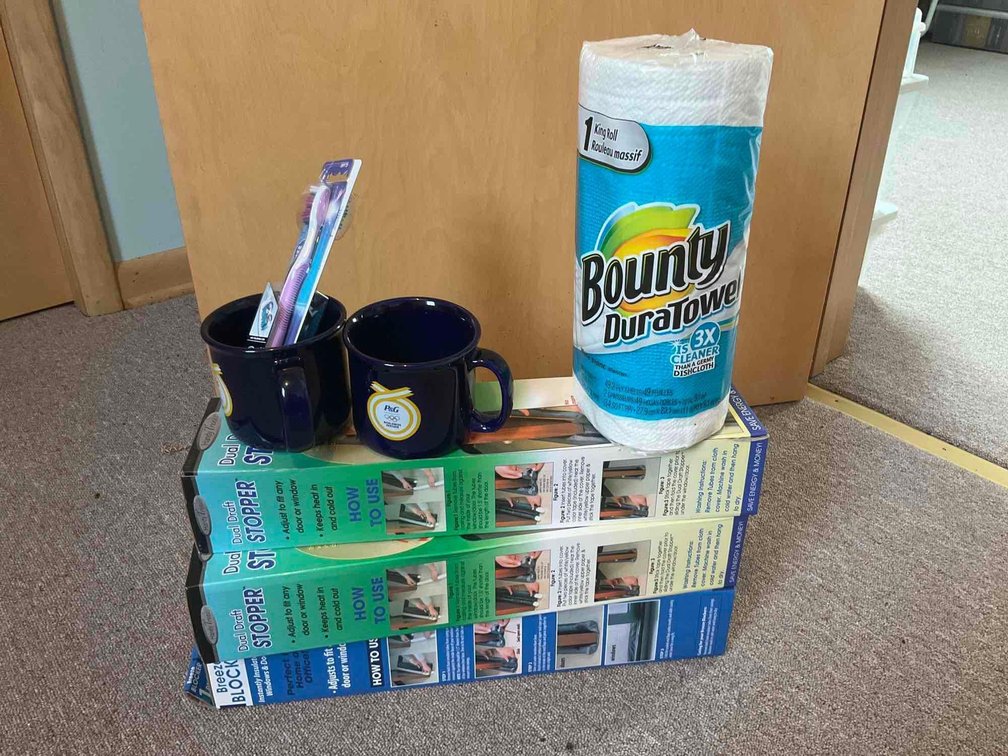Door draft stoppers, cups, toweling & toothbrushes-Upstairs