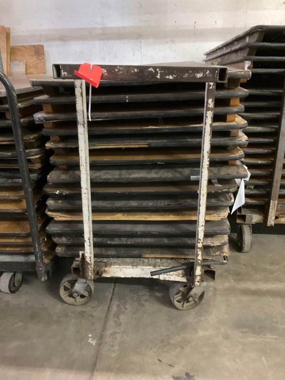 Stack of 8’ folding banquet tables & cart dolly 