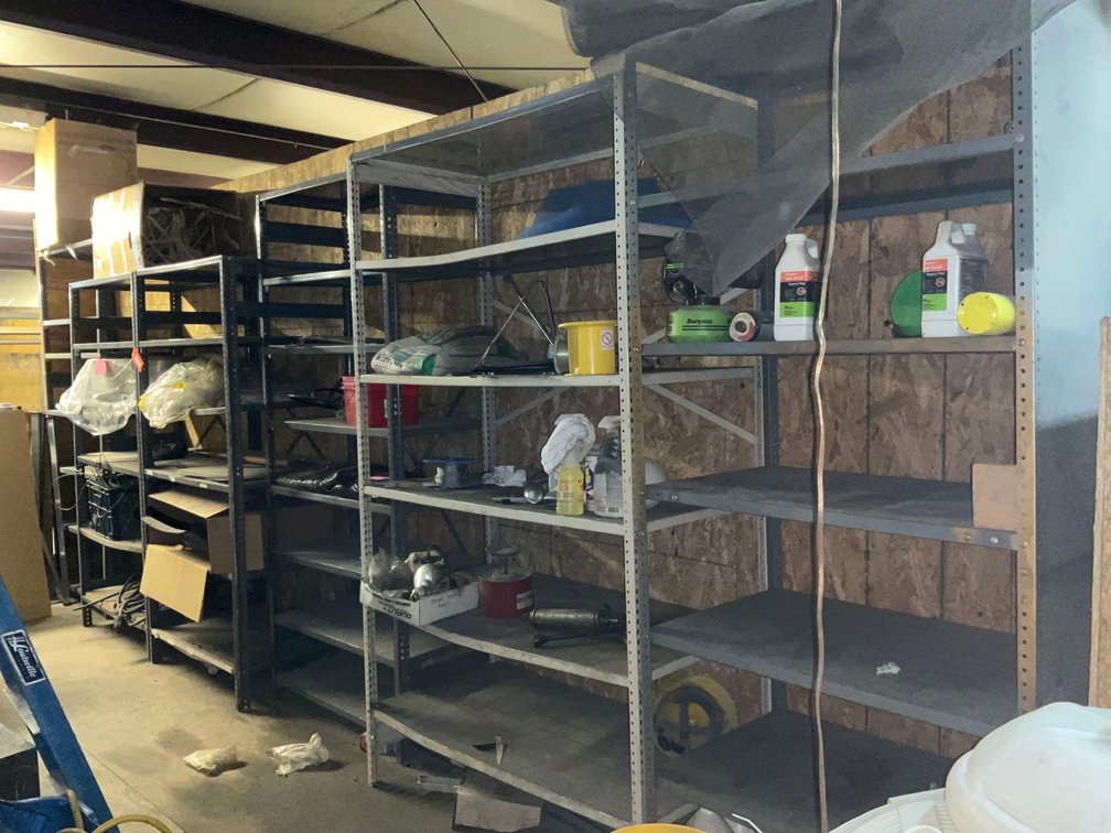 Steel shelving & contents-Upstairs of warehouse, tools needed for removing from wall 