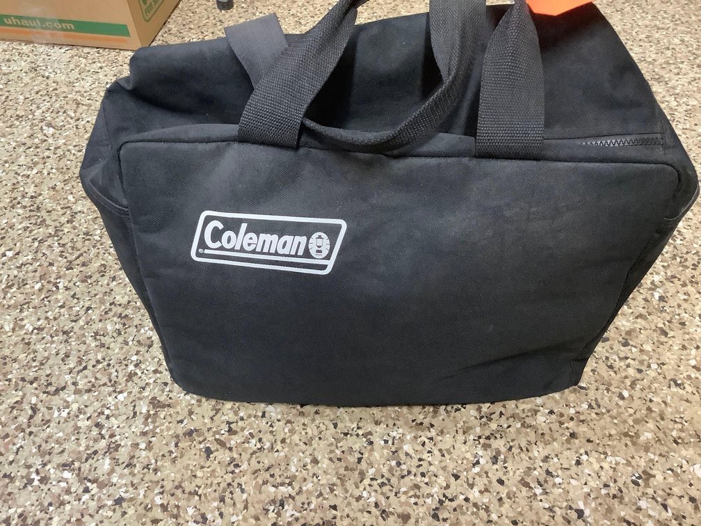 Coleman heater with propane cylinders & bag