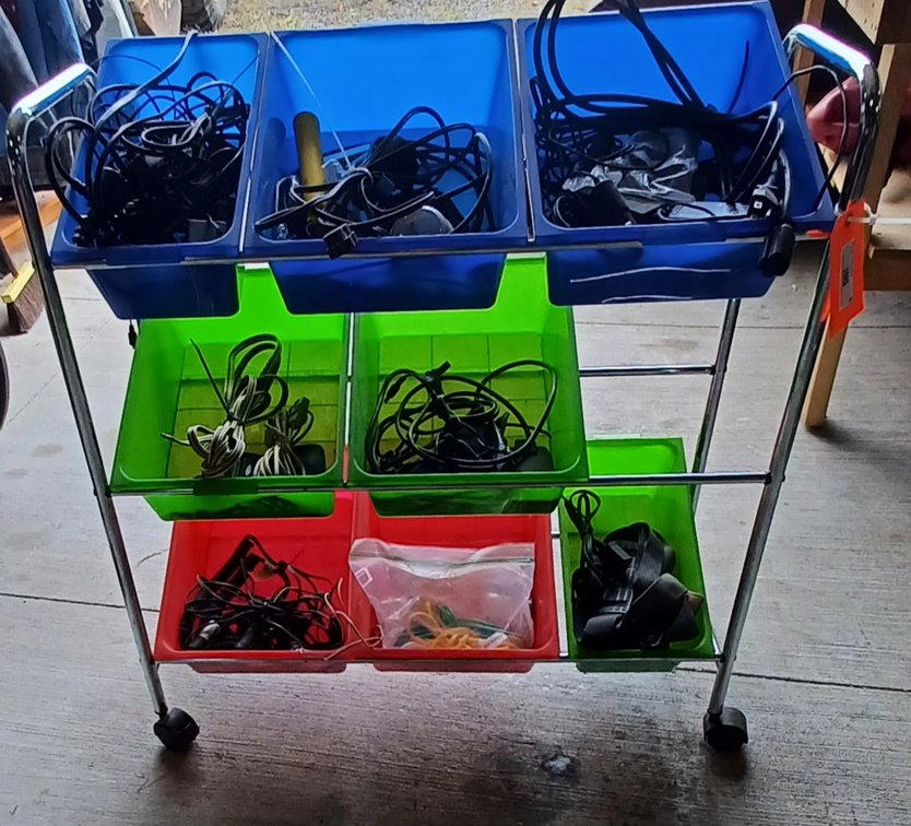 Mobile storage bin 32x13x34 w/ext cords, speaker wire, electronic cords,bar stool & more