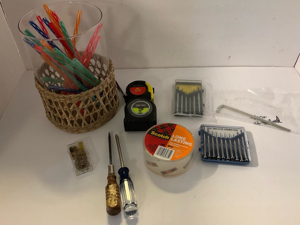 Tape measurers, screwdrivers, glass canister of straws-Kitchen 