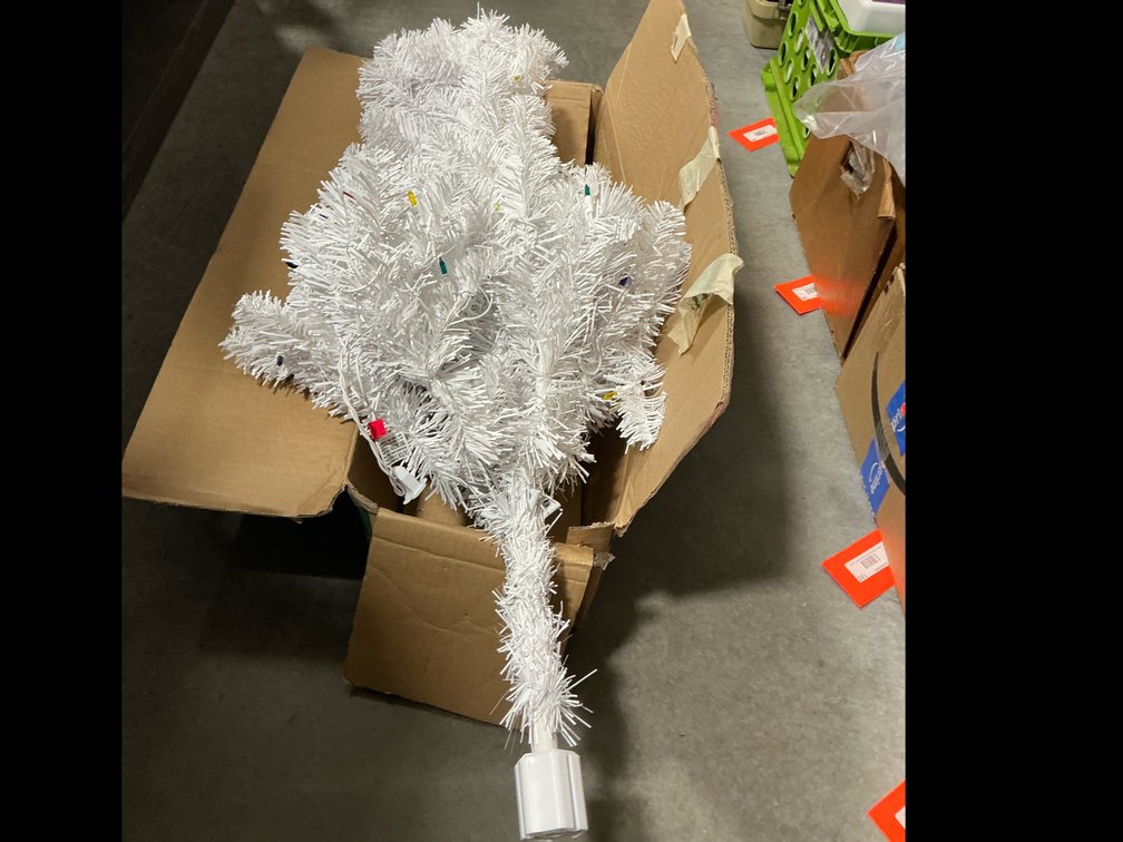 Artificial Christmas tree with lights approximately 4 feet tall