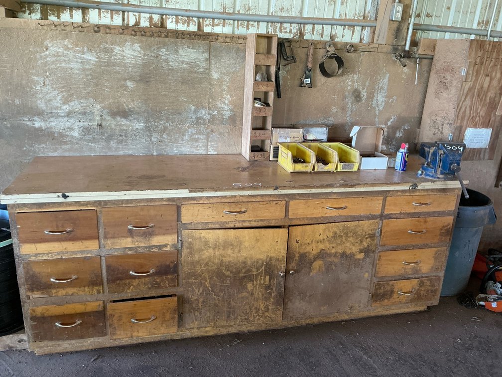 Wooden Workbench with Mounted Bench Vise, Storage Organizers, Hand Tools, and More