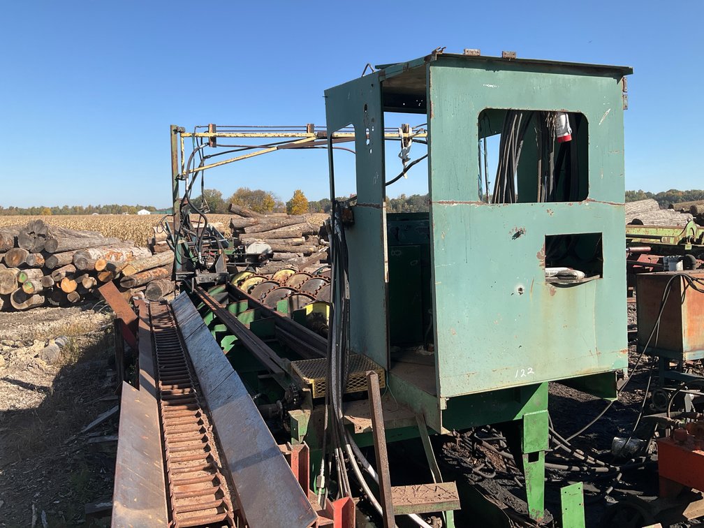 Log Debarker System with Operator Cab