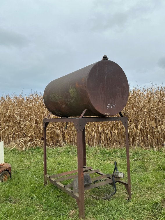 Fuel Storage Tank on Elevated Steel Stand with Pump and Hose
