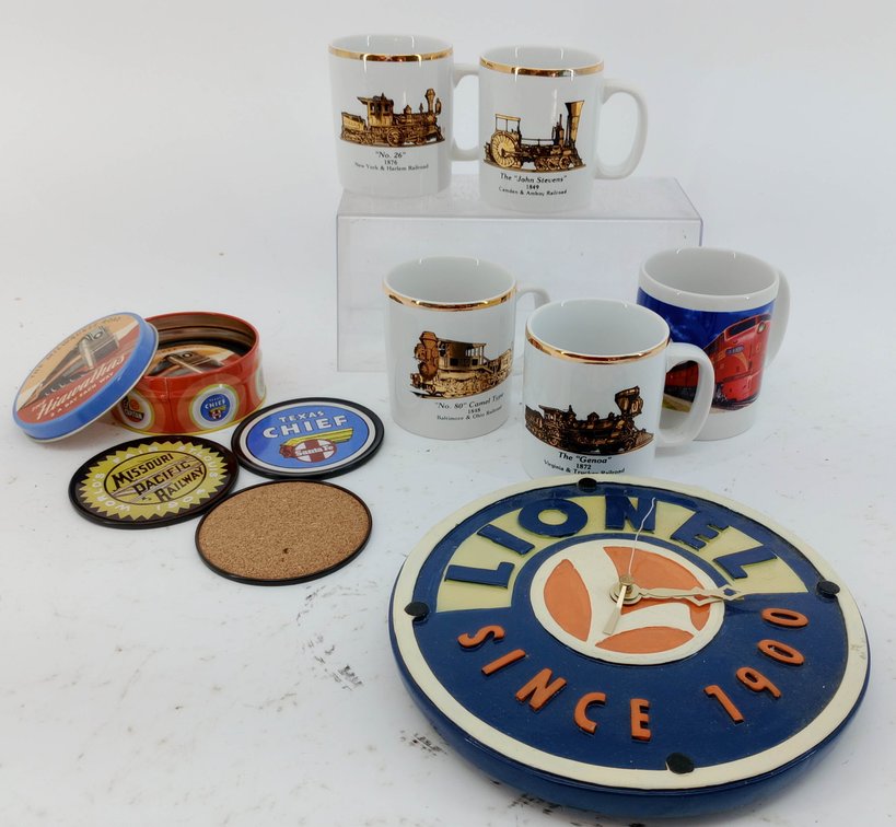 LIONEL WALL CLOCK, 5 RAILROAD MUGS PRR & GOLD LOCOMOTIVE, TIN OF 4 RAILWAY COASTERS  INV 263310059